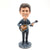Resin manufacturers customized celebrity guitar doll car decoration spring shaking head model hand gift